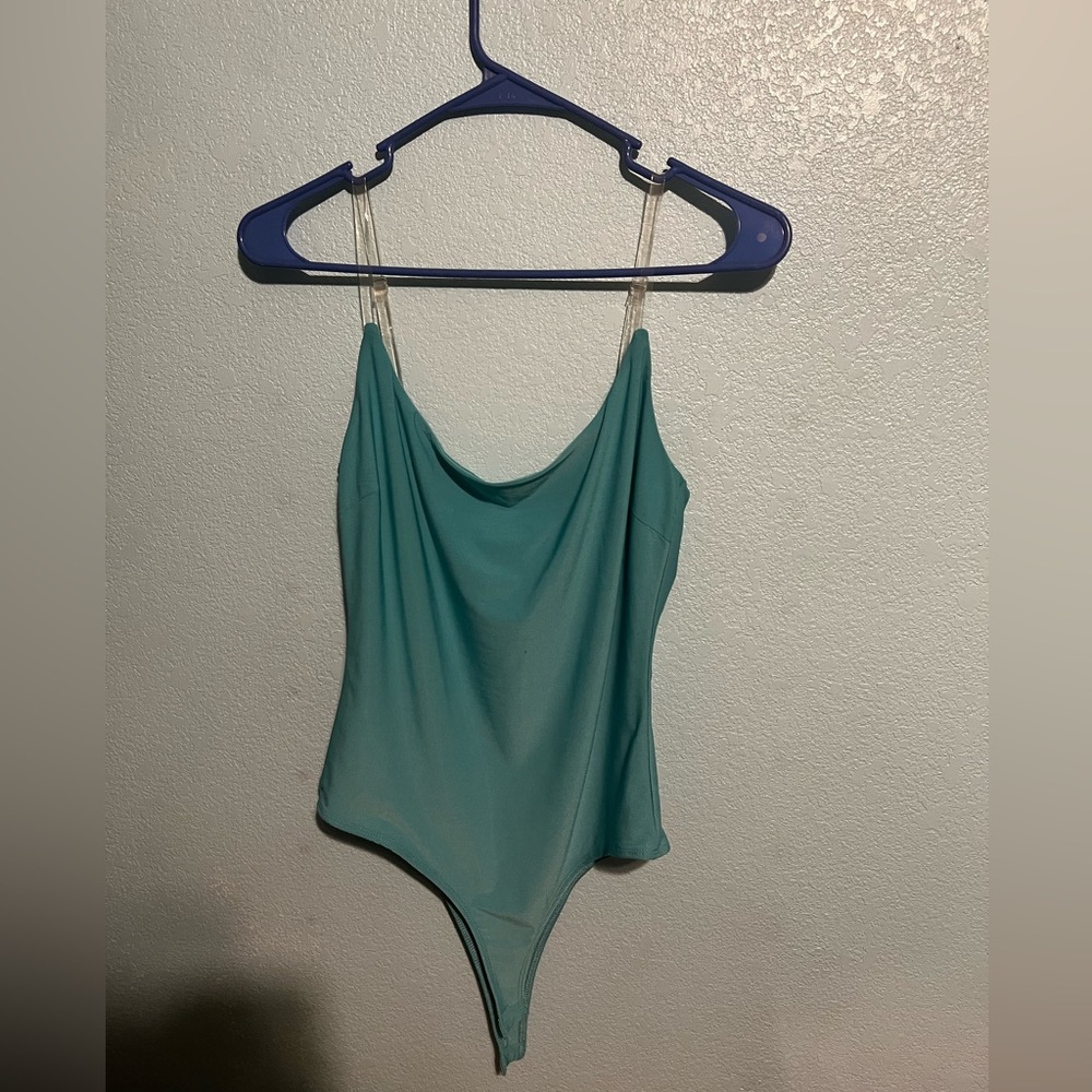 Super cute turquoise body suit. Never worn!